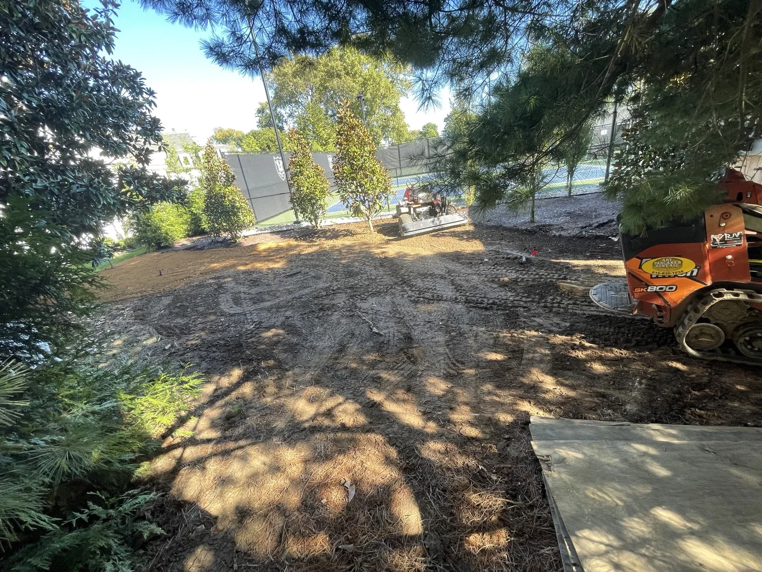 Bare prepared ground before sod installation